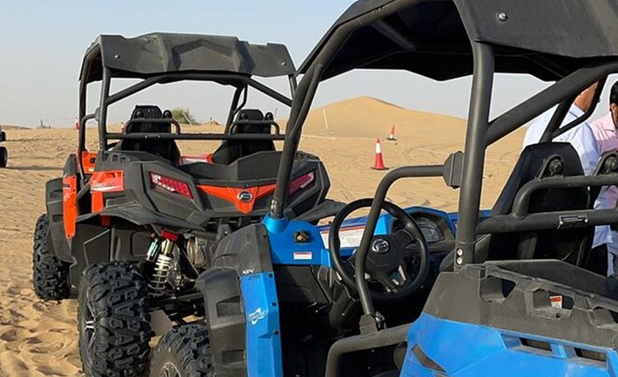 Polaris dune buggy adventure tracks in golden sand